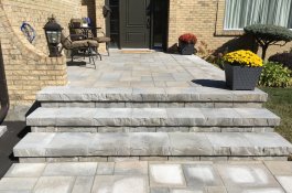 Main entrance porch and steps in unistone